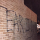 Shortly after video surfaced purportedly showing members of a chapter of Sigma Alpha Epsilon singing a racist chant, someone spray-painted “Tear It Down” on the side of the frat house at the University of Oklahoma. (NBC News screenshot)